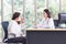 Asian elder woman consults with doctor about her symptom or health problem in examination room at hospital