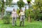 Asian elderly couples are walking inside the backyard