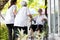 Asian elderly mother and her daughter to visit meet an old friend,friendly senior woman sit in wheelchair welcoming childhood