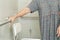 Asian elderly old woman patient use toilet support rail in bathroom, handrail safety grab bar, security in nursing hospital