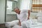 Asian Elderly senior man back pain and illness on bed at home,unhappy elderly touch on back serious and tried,Elderly Care Concept