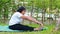 Asian elderly woman exercising at home