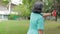 Asian elderly woman exercising outdoors in the park.