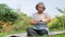 Asian elderly woman exercising in the park in the morning