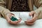 Asian elderly woman holding pill drug in hand, strong healthy medical concept