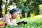 Asian elderly woman picnicking in the park