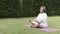 Asian Elderly woman practicing meditating yoga