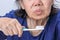 Asian elderly woman with a toothbrush. Dental health