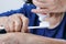 Asian elderly woman trying use toothbrush ,hand tremor.