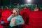 Asian elderly women wearing glasses are excitedly watching 3D movies in the cinema, holding popcorn in their hands