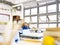 Asian elementary schoolboy sitting alone in classroom