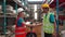 Asian employee or worker shake hands to employer man for greeting, dealing, teamwork, in warehouse. woman and man engineer wearing