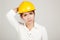 Asian Engineer girl with hard hat feel sick