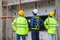 Asian engineer technician team inspector of workers to productivity build a house in the construction site to control the quality