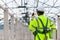 Asian engineer technician watching construction control in the construction of roof structures on construction site an Unfinished