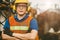 Asian engineer worker wearing earmuffs ears protection anti noise and safety suit working in factory portrait