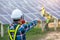 Asian engineer working on checking equipment in solar power plant, Pure energy, Renewable energy