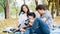 Asian family come for picnic at the park.