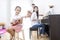 Asian family,daughter playing ukulele,father playing guitar,moth