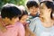 Asian Family Enjoying Walk In Summer Countryside