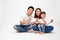 Asian family holding protective mask for prevent virus sit on white background.
