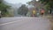 Asian family jogging outdoors with the little girl kids cycling on road in evening for exercise