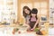 Asian family mom and child enjoy cooking salad together in kitchen room at home