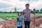 Asian family plating tree for organic farm in rural on sky background