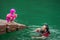 Asian family swimming at the Kenyir Lake, Malaysia