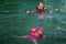 Asian family swimming at the Kenyir Lake, Malaysia