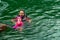 Asian family swimming at the Kenyir Lake, Malaysia