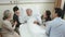 Asian family visiting grandfather in hospital