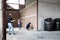 Asian family visiting their new home being built,inspect the house structure,man measuring size of the room on the brick walls,