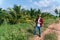 Asian Farmer in a coconut plantation, Coconut palm trees for Coconut juice, Drink coconut water  in Thailand