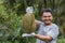 Asian farmer holding Durian is a king of fruit