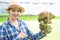 Asian farmer at hydroponic vegetables salad farm.