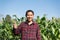 Asian farmer showing thumb up in the corn field