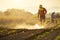 Asian farmer working in the field and spraying chemical or fertilizer to young green corn field