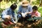 Asian farmers are teaching their children to care for the plants with patience and effort.