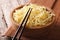 Asian fast food: Ramen in a wooden bowl closeup. horizontal