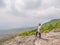 Asian Fat trekker on Yeabmek Cliff Phu Kradueng mountain national park in Loei City Thailand.