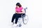 Asian fat woman sitting on a wheelchair have pain in the stomach