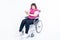 Asian fat woman sitting on a wheelchair His hands are kinking