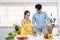 Asian father mother pregnant baby, are spending free time together on father\\\'s holiday, cook with mom in spare