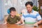 Asian Father and son having fun making fluffy slime, Dad and son playing and being creative by science experiment homemade toy