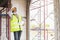 Asian female architect engineer wearing a mask to prevent the outbreak of COVID-19 at the construction site with exhaustion