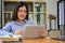 Asian female business officer worker at her office desk, using digital tablet