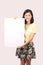 Asian female in casual wear holding notice board - Series 2