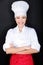 Asian female chef in chef whites uniform and hat