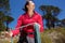 Asian female climber with rope on mountain